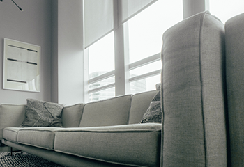 Modern apartment living room with sleek Somfy shading system